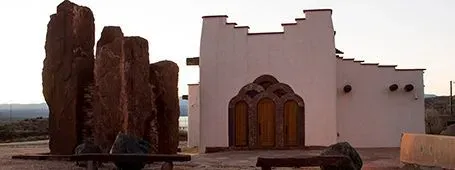 An exterior view of a mission style church in New Mexico.