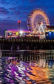 At night, the Santa Monica, California ferris wheel and pier. 