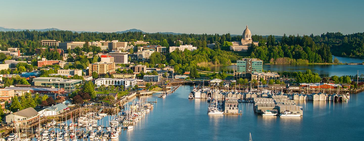 Downtown view of boats in a river in Olympia, Washington.