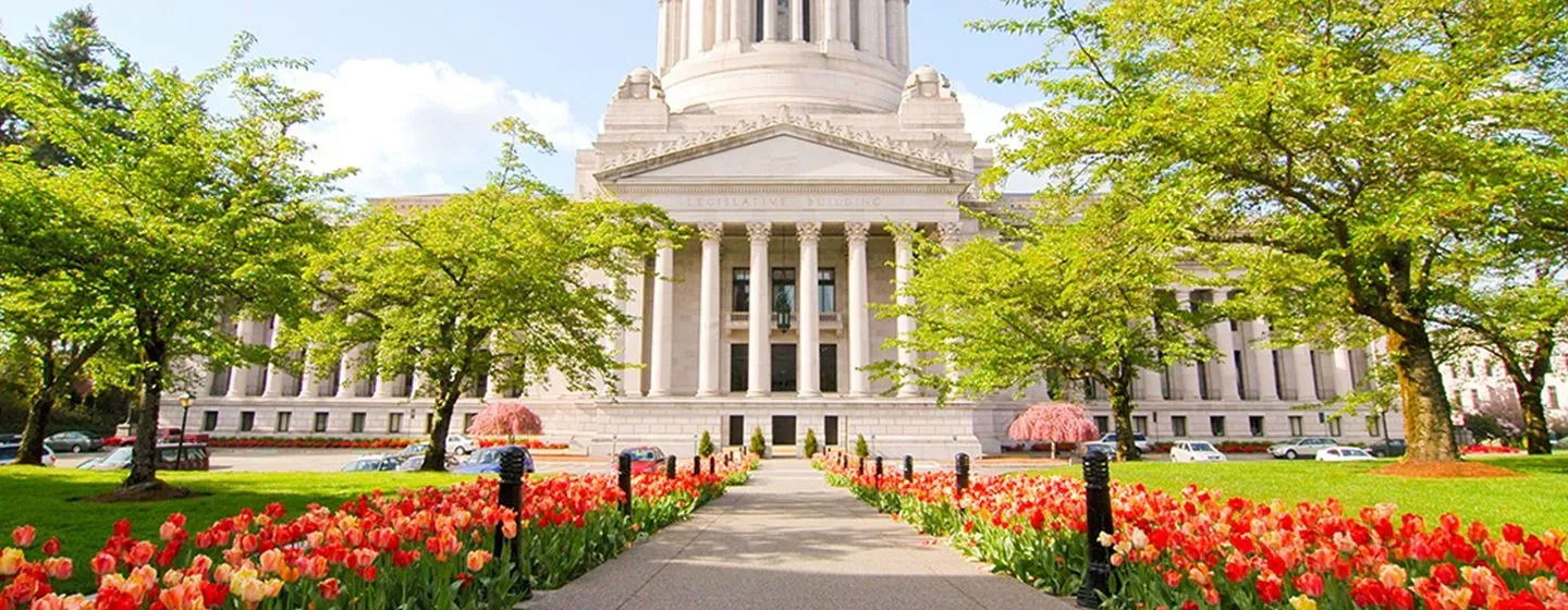 Historical building surrounded by tulips in Olympia, Washington.