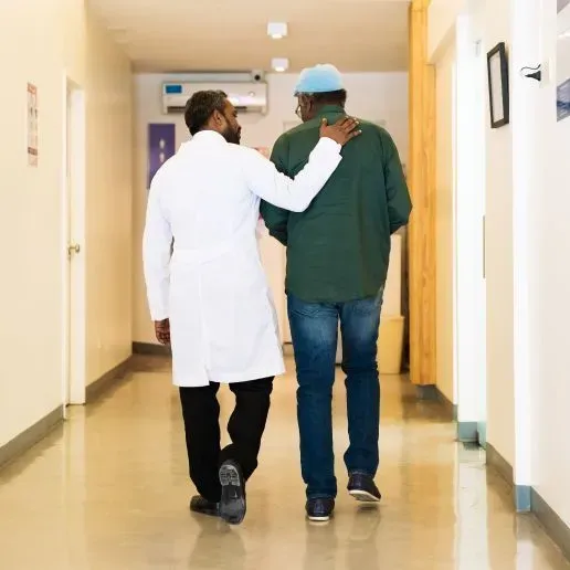 Doctor walking with patient