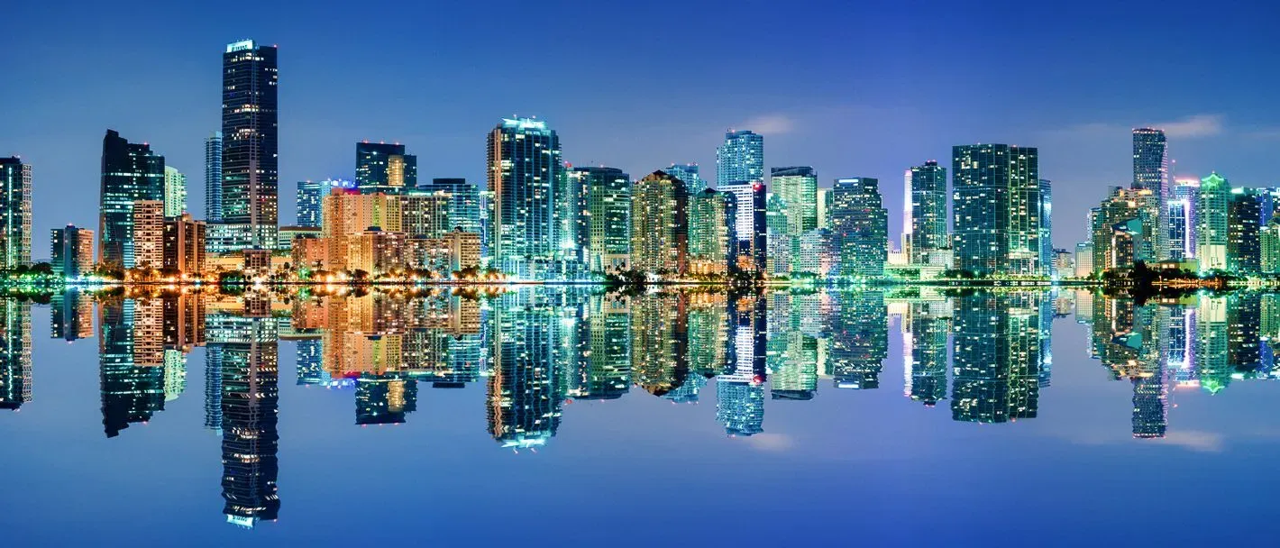 Miami Skyline at night, where PS&D recruits physicians in Florida.