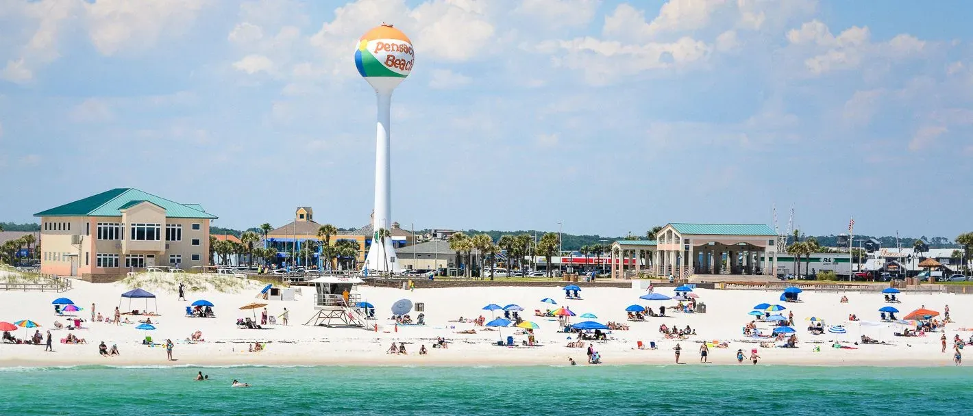 Beach goers at Pensacola Beach in Escambia County, where PS&D recruits physicians in Florida.