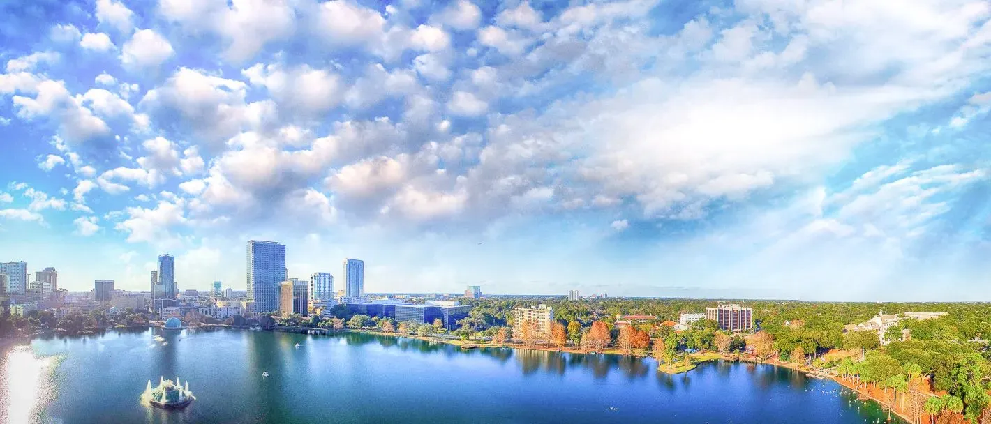 Orlando aerial view, skyline and Lake Eola at dusk, where PS&D recruits physicians.