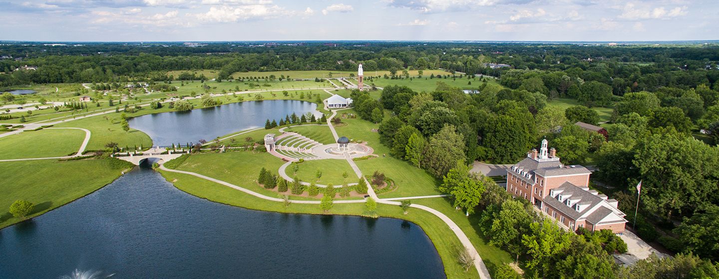 Aerial view of a large lake, grassy fields and historical landmarks in the state of Indiana. 