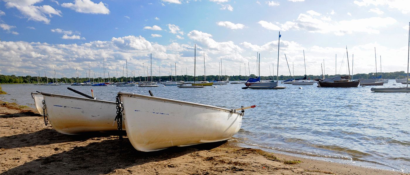 Boats on the shore of Lake Calhoun in Minneapolis, Minnesota where our Physician Recruiters help hire physicians.