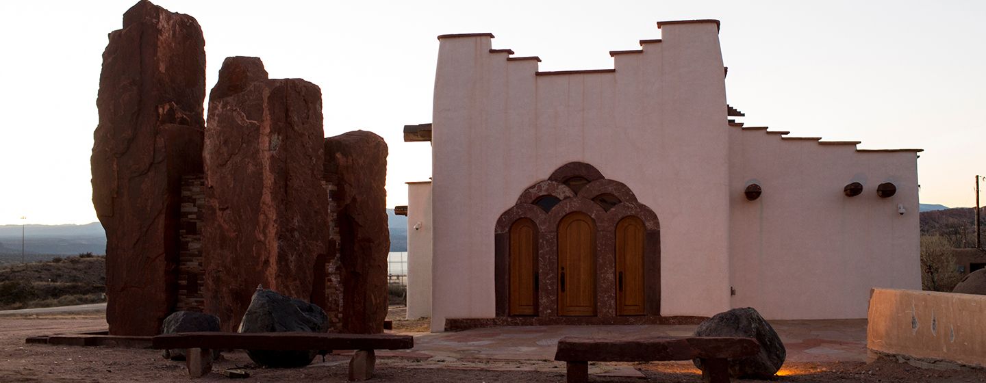 An exterior view of a mission style church in New Mexico.