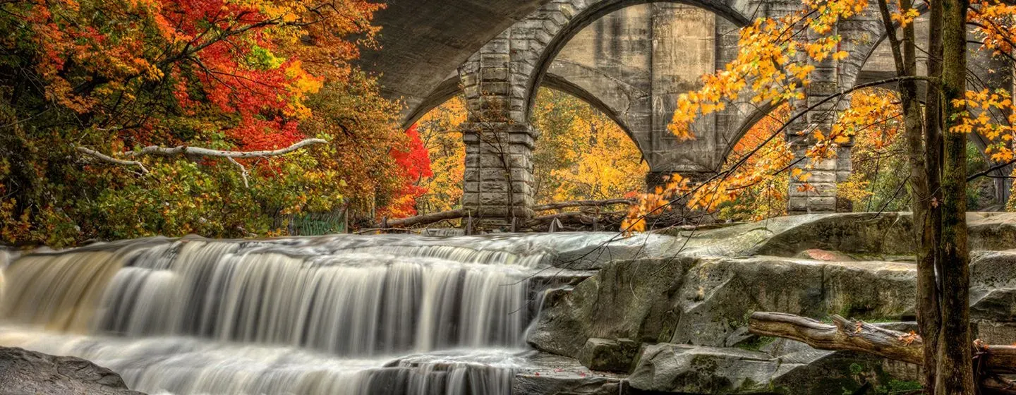 A waterfall surrounded by trees with colorful leaves in Ohio.