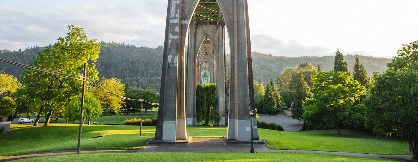 Base of a bridge surrounded by a forest in Oregon.