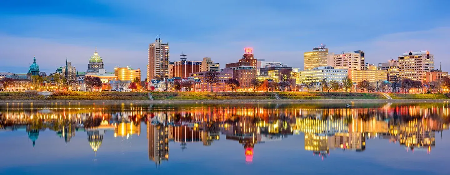 Cityscape riverfront nighttime view of Pittsburgh, Pennsylvania.