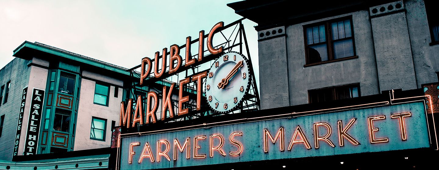 Seattle, Washington's famous Pike Place neon lit sign that says, "Public Market, Farmers Market."